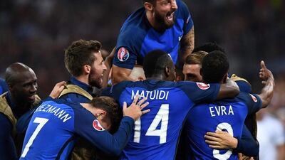 France forward Olivier Giroud (top) and teammates celebrate during their Euro 2016 Group A win over Albania on Wednesday night. Franck Fife / AFP / June 15, 2016