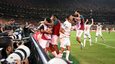 Morocco's players celebrate their equalising goal in the last 32, before beating the Netherlands on penalties. EPA