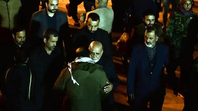 Iraj Masjedi (centre) Iran's ambassador to Iraq, receives condolences as the coffins of military commander Qassem Suleimani is carried toward the Imam Ali Shrine, in the shrine city of Najaf in central Iraq during a funeral procession. AFP