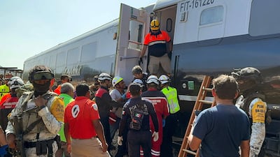 Rescue personnel help passengers from the train that derailed in the southern Mexican state of Oaxaca. AFP