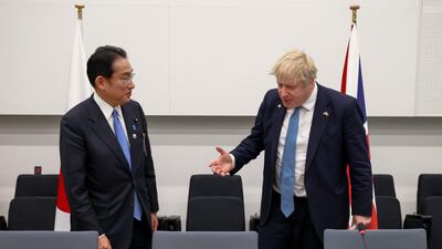 Japanese Prime Minister Fumio Kishida and Boris Johnson attend a bilateral meeting. Getty Images