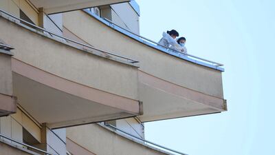 Forensics officers take samples on a balcony after five people appeared to have jumped from a seventh-floor apartment, in Montreux, Switzerland. Reuters