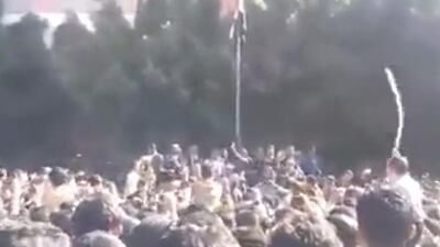 A screengrab from Yemen 24 which shows a group of students in Sanaa llistening to Houthi representatice. The students began to throw stones in the direction of the Houthi representatives and a man entered the scene with a stick and discplined some of the students.