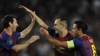 Barcelona's Andres Iniesta celebrates with his teammates.