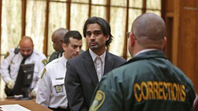 Derek Medina, is led out of the courtroom after he was found guilty of second-degree murder in Miami. Walter Michot / The Miami Herald via AP Photo