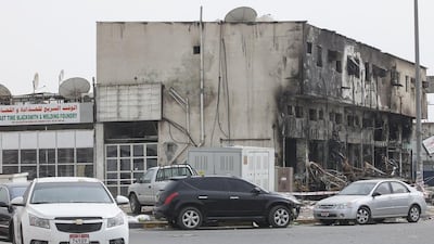Expatriate mechanics, technicians and helpers who work in the industrial area attributed the fire to an electrical short circuit within the building in Musaffah Industrial Area-7. Mona Al Marzooqi/ The National