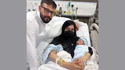 Azrin Ismi and Wakkar Mohammed with their new arrival, Omar, born at Aster Hospital in Mankhool on National Day. Photo: Courtesy of the family
