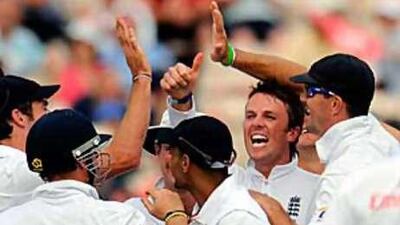 England's Graeme Swann, second from right, celebrates with his teammates after dismissing Bangladesh's Shakib Al Hasan on Saturday.
