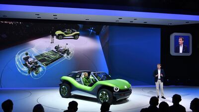 Volkswagen representative Frank Welsch introduces the car at its unveiling. Harold Cunnigham / AFP