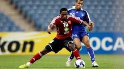 Ahmed Khalil, left, playing for Al Ahli could be a English Premier League star for Portsmouth next season.