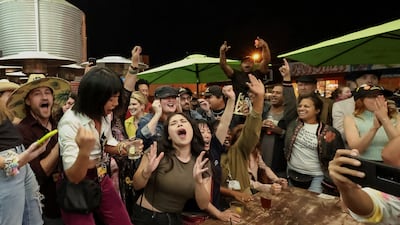Sag-Aftra members celebrate after a deal was reached between the actors' union and Hollywood studios. Reuters