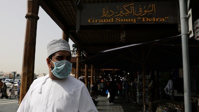A man wears a protective face mask, following the outbreak of the new coronavirus, as he walks at the Grand Souq in old Dubai, UAE. Reuters