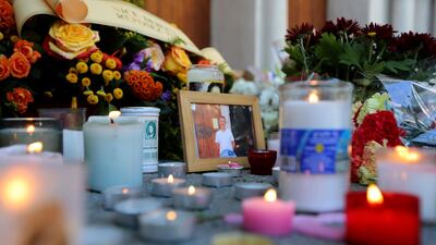Tributes to one of the victims outside the church. AFP