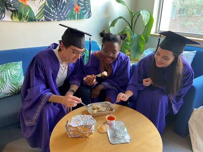 Munib Mesinovic, Vongai Christine Mlambo and Daria Zahaleanu have dim sum with friends via an chat room, before their online graduation ceremony commences at NYU AD on May 27, 2020. Reem Mohammed / The National