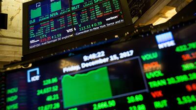 Monitors display stock information on the floor of the New York Stock Exchange (NYSE) in New York, U.S., on Friday, Dec. 15, 2017. U.S. stocks gained with the dollar as investors assessed messages from the Federal Reserve and European Central Bank meetings this week with concerns lingering about the prospects for U.S. tax overhaul. Photographer: Michael Nagle/Bloomberg