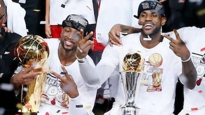 Dwyane Wade, left, and LeBron James let everyone know how many titles they've collected in three season.