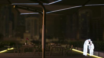 A hologram is seen projected onto a model plan for the launch of Qasr Al Hosn 2018 Master Plan, showcasing details of the comprehensive conservation, restoration and development for Qasr Al Hosn and the surrounding areas in Abu Dhabi. Mona Al Marzooqi / The National