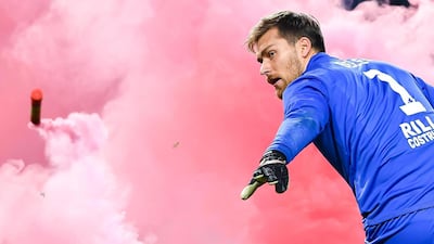 Benevento's goalkeeper Vid Belec throws a flare off the field during the Italian Serie A soccer match Genoa Cfc vs Benevento Calcio at Luigi Ferraris Stadium in Genoa, Italy. Simone Arveda / EPA
