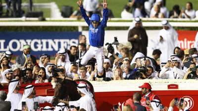 Christophe Soumillon celebrates after winning the Dubai World Cup with Thunder Snow. EPA