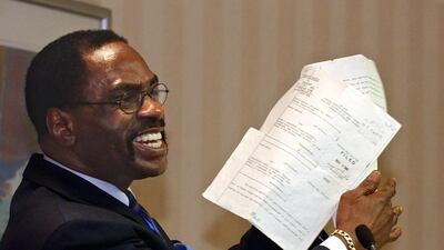 Rubin Carter, holds up the writ of habeas corpus that freed him from prison after 19 years in jail. AP File Photo