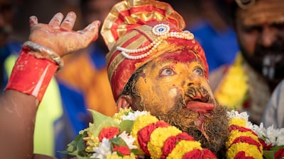 A Tamil Hindu priest has antiseptic powder on his face in a procession during the Thaipusam festival at Batu Caves, outskirts of Kuala Lumpur. AP Photo