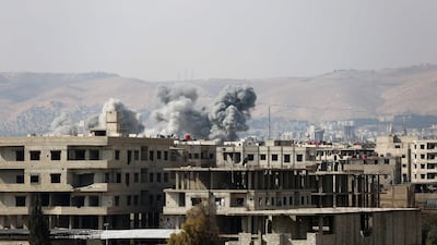 Smoke billows following a regime air strike on the rebel-held town of Haza, in the besieged Eastern Ghouta region on the outskirts of Damascus, on Friday. AFP