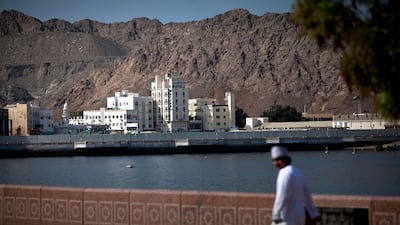 A man walks on the Corniche in the Mutrah district in Muscat, the capital of the Sultanate of Oman. Silvia Razgova/The National