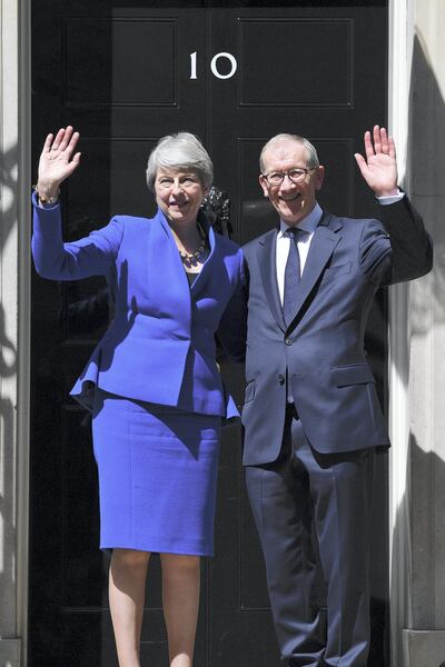 Theresa May, pictured with husband Philip, departed 10 Downing Street last July. Courtesy: Getty Images