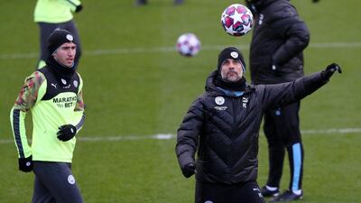 Manchester City defender Aymeric Laporte, left, and Pep Guardiola. Getty