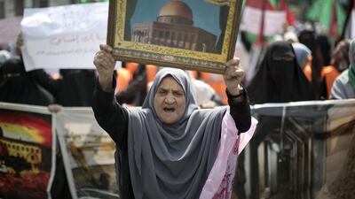 A Palestinian woman shouts slogans during a protest organised by Hamas in Gaza City. Mahmud Hams / AFP Photo