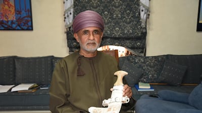Mohammed Al Sayegh holding up one of his khanjar: A master craftsman from the coastal city of Sur, near Oman’s eastern tip, Al Sayegh is the scion of a family that has been making khanjar for more than 100 years. Photo: Ismael David Mujahid