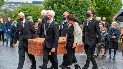 The remains of John Hume are taken into St Eugene's Cathedral. AFP