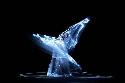 Iris van Herpen created a look filled with luminescent algae. Reuters