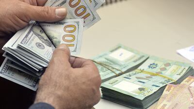 US and Lebanese banknotes at a currency exchange in Beirut. The Lebanese currency sank to a new low against the US dollar on Tuesday. Getty