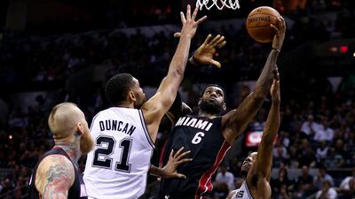 LeBron James, No 6, of the Miami Heat goes to the basket against Tim Duncan of the San Antonio Spurs during Game 2 of the 2014 NBA Finals at the AT&T Center on June 8, 2014 in San Antonio, Texas. Andy Lyons / Getty Images