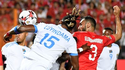 DR Congo defender Christian Luyindama fights for the ball with Egypt defender Ahmed Elmohamady. AFP