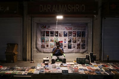 An Iraqi man sells books at his shop on Mutanabbi Street in central Baghdad. AFP