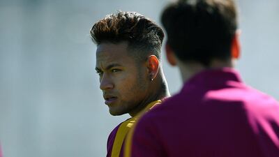 Barcelona’s Brazilian forward Neymar arrives for a training session at the FC Barcelona Joan Gamper Sports Centre in Sant Joan Despi, near Barcelona on April 16, 2015, on the eve of the La Liga match FC Barcelona vs Valencia CF. AFP / LLUIS GENE