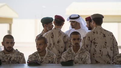 Sheikh Mohammed bin Zayed speaks with Lt General Hamad Thani Al Romaithi, Chief of Staff of the Armed Forces, centre left, and other military officers during the inauguration of the camp. Rashed Al Mansoori / Crown Prince Court - Abu Dhabi