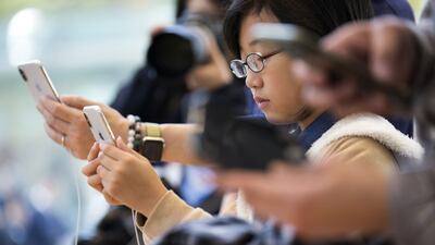 A girl tries an iPhone X at the Apple Omotesando store on November 3, 2017 in Tokyo, Japan. Tomohiro Ohsumi / Getty Images