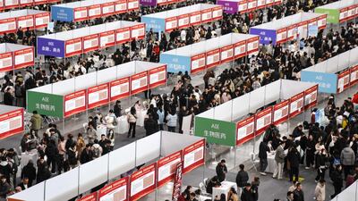 Thousands attend a job fair at an exhibition centre in Harbin, in Heilongjiang province, north-east China. AFP