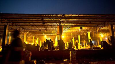 Pakistani vendors, arrange their fruits and vegetables as they start their day at a wholesale market on the outskirts of Islamabad, Pakistan. Muhammed Muheisen / AP Photo