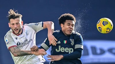Bologna's Mitchell Dijks and Juve goalscorer Weston McKennie go for a header. AFP