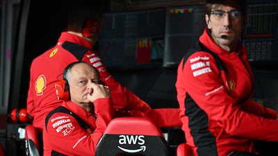 Ferrari's team principal Frederic Vasseur listens to his technical team after Carlos Sainz's car was damaged during practice. AFP