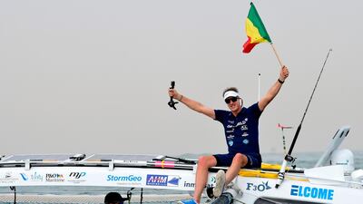 Patrick bol, Dutch skipper of the Row4ocean rowing trimaran waves to the crowd as they leave Dakar to cross the Atlantic on December 14, 2018. AFP