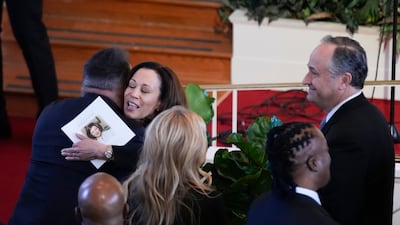 Vice President Kamala Harris hugs Brooks during the tribute service. AP