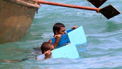 The crews use ropes to reel in the divers and their catches after they free-dive using only a wooden nose clip to the oyster fields on the seabed.