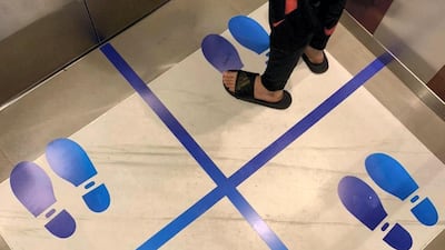 Lifts in Central Park Towers, DIFC, encouraging social distancing
