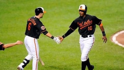 Adam Jones, right, has hit 14 home runs for the Baltimore Orioles this season. Greg Fiume / Getty Images