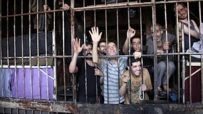Inmates in Aleppo’s main prison on Thursday after Syrian troops broke through a year-long rebel siege on the facility. George Ourfalian / Reuters / May 22, 2014